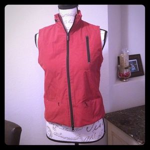 Express red outdoor vest with rollout rain hood